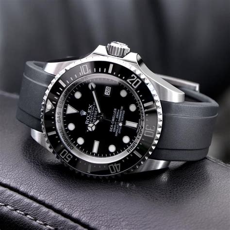 rolex with black rubber band.